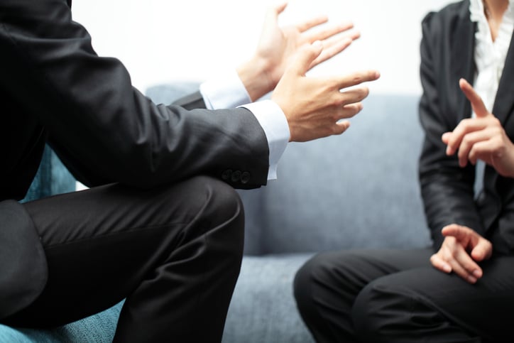 Businesspeople engaging in discussion on ABSD