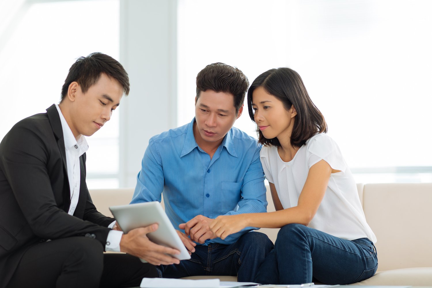 Couple talking to a real estate agent