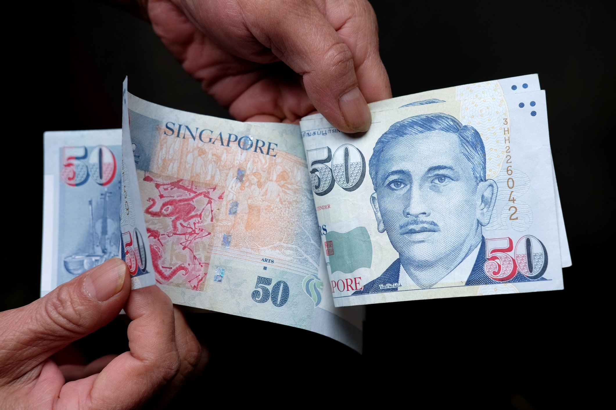 50 dollar notes in hand