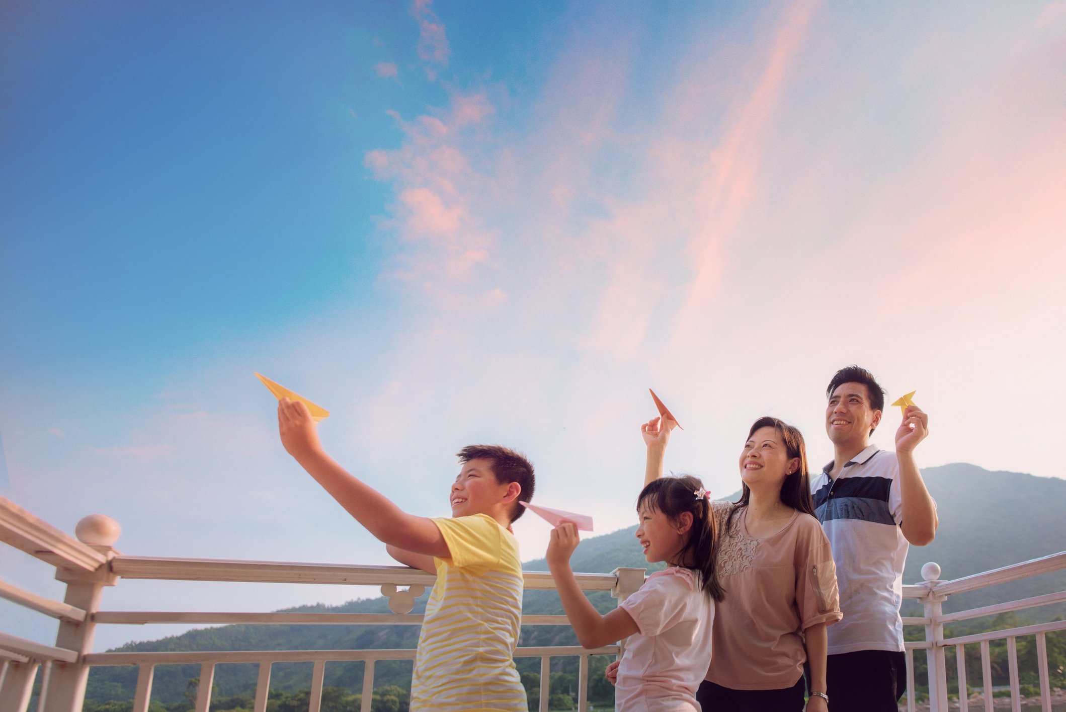 family playing with kites