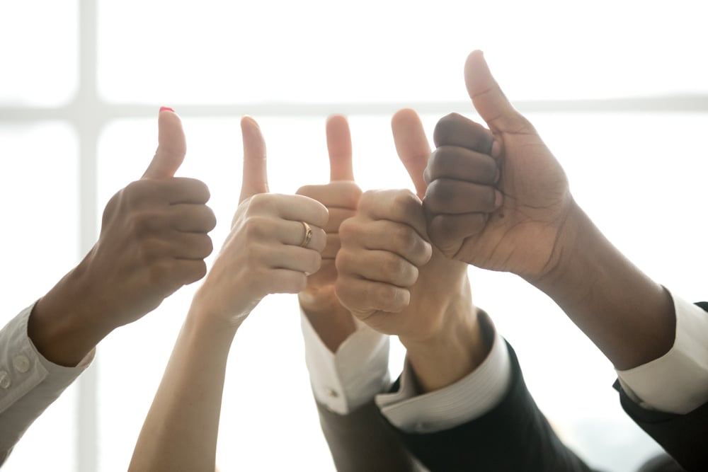 Lots of hands with upraised thumbs