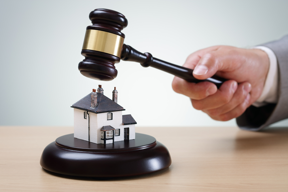 Auctioning off a house with a gavel