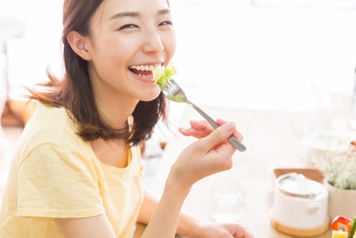 lady eating vegetable