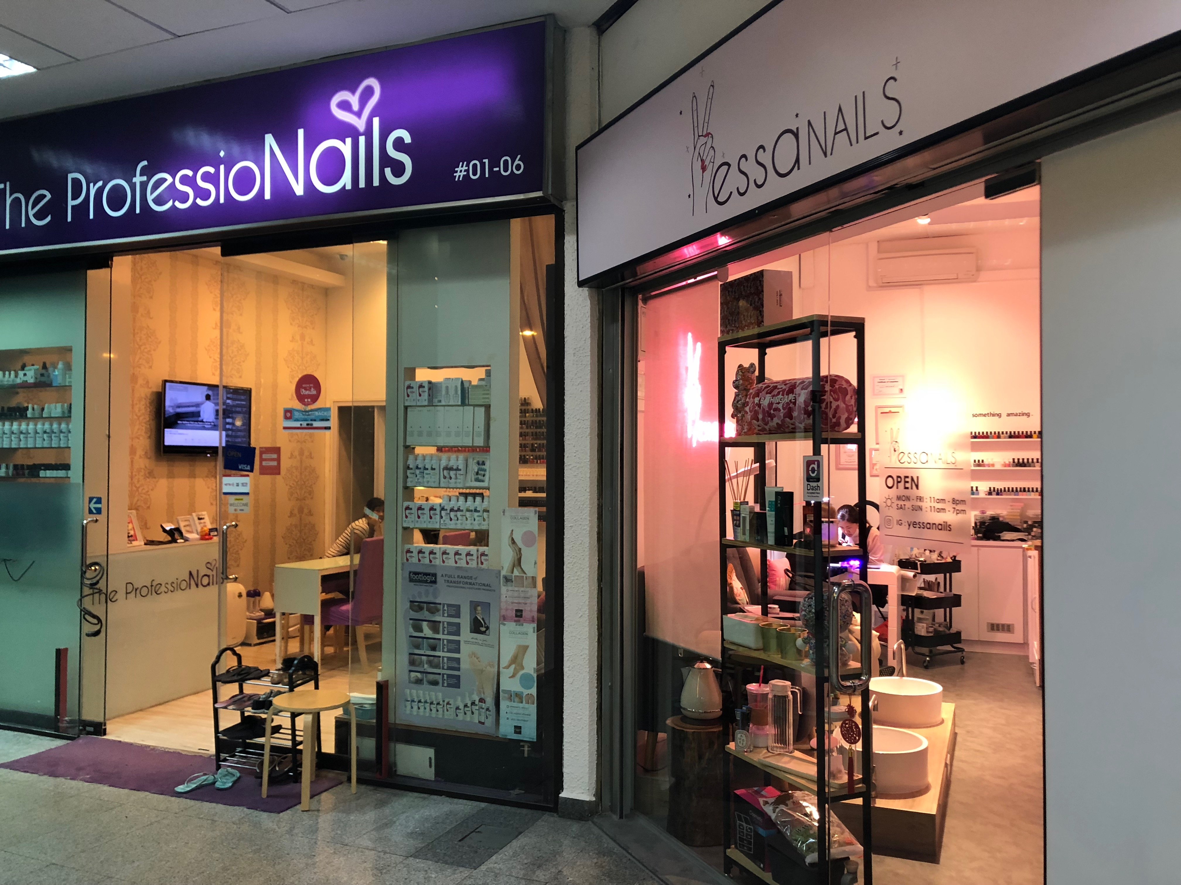 Two nail polish shops located beside each other.