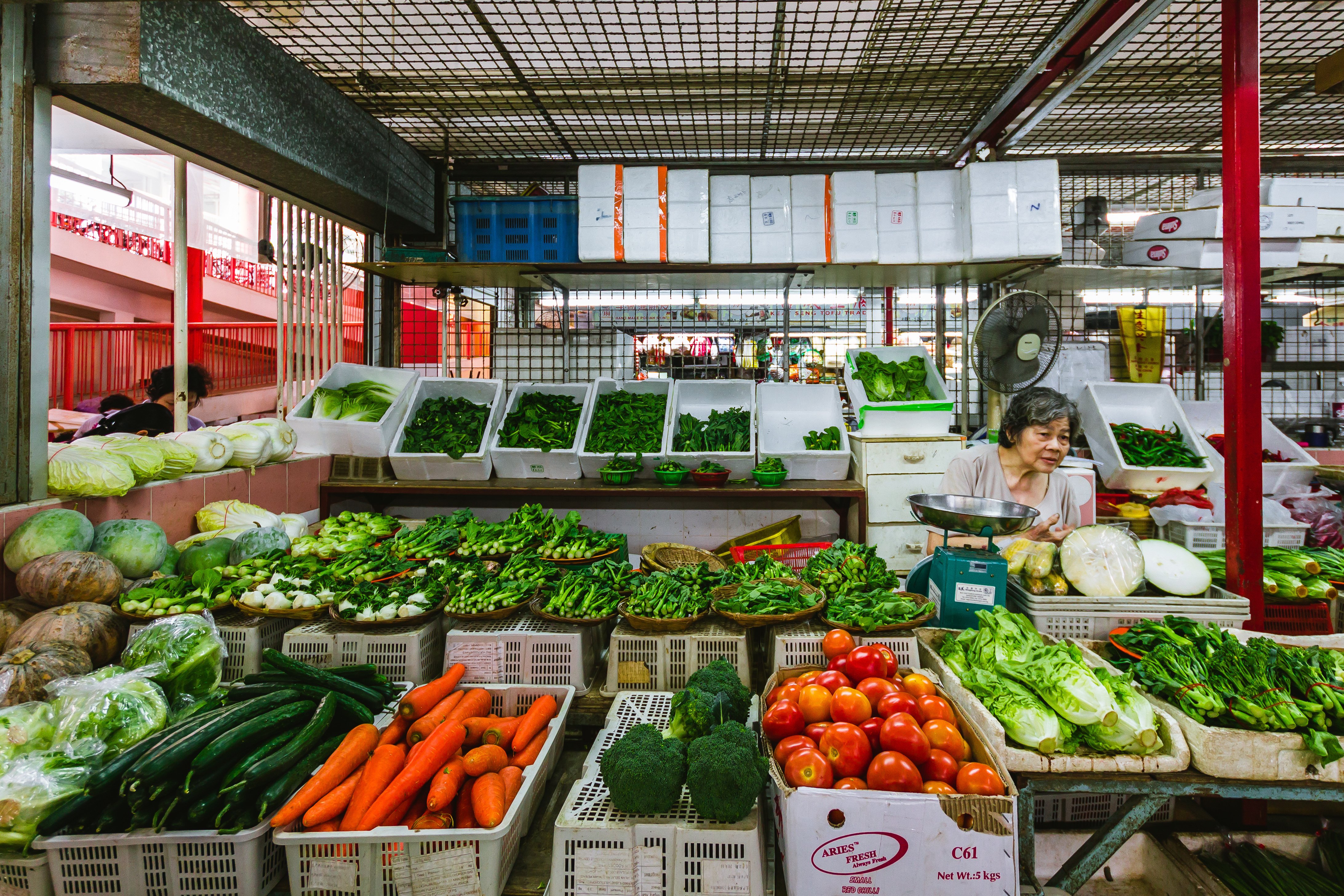 wet market stall in chinatown selling fresh vegetables