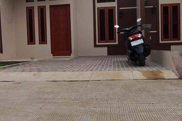 Di rumah cluster, dekat pintu tol sawangan,stasiun,lokasi strategis dan bebas banjir
