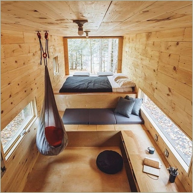 Desain Kamar Triplek di Kabin Tengah Hutan yang Asri