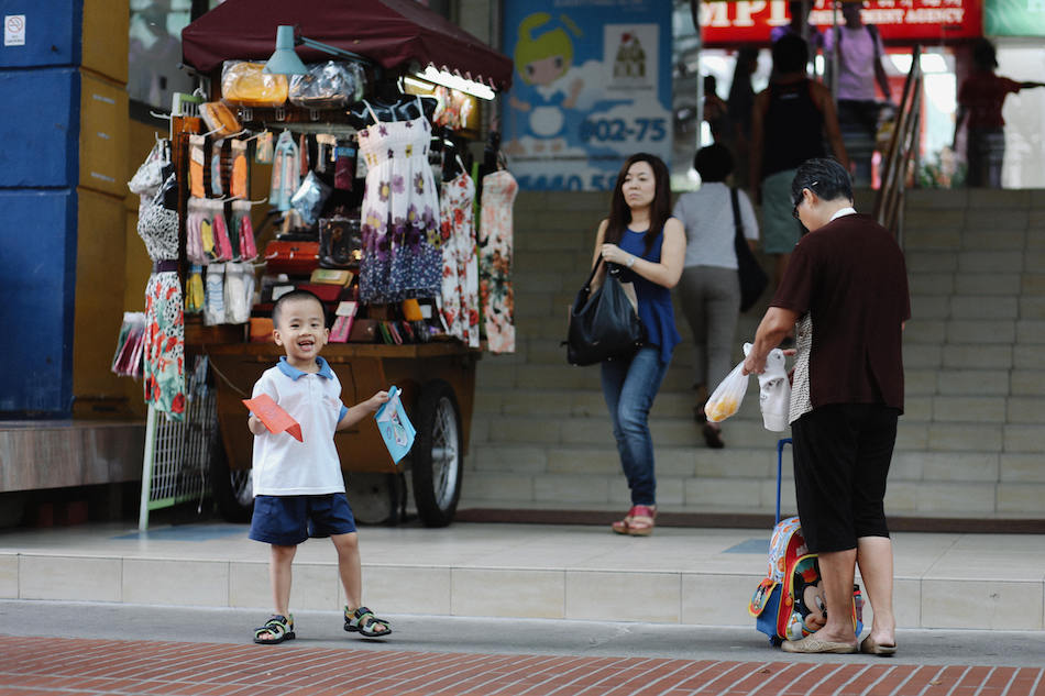 East Coast katong singapore people in front of a shopping centre mall