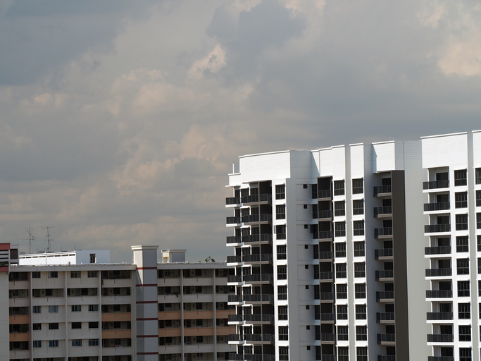 Singapore public housing BTO against dark clouds