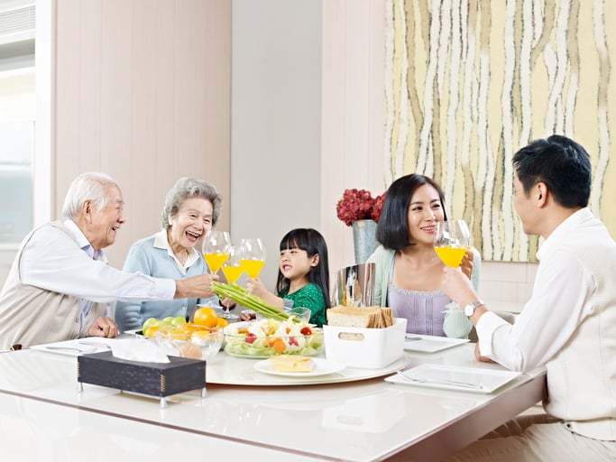 Three-generation family having meal at home