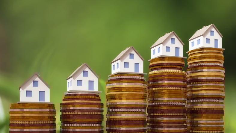 Houses atop increasing coins