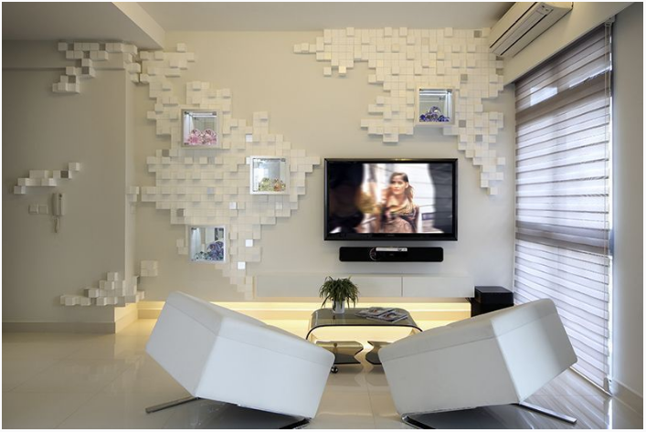 Walls, ceiling, flooring, and even seating furnishings all washed in white create the illusion of a bigger space in this 1,000-sq-ft condo unit in Geylang. The texture and 3D effects on the wall add visual interest without adding too much colour, which is perfect for homeowners who prefer a monochromatic look