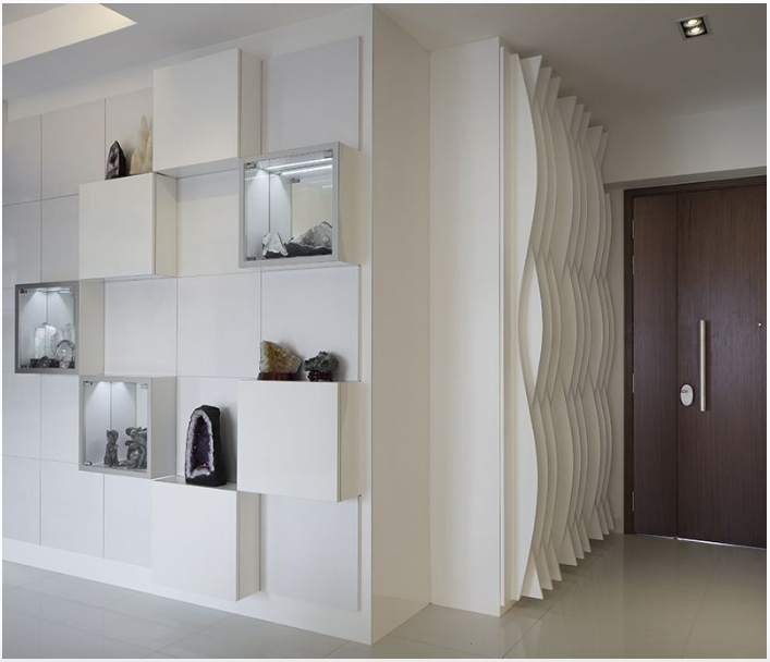 The wavy cutouts by the entryway acts as a grounder, separating one area from another.