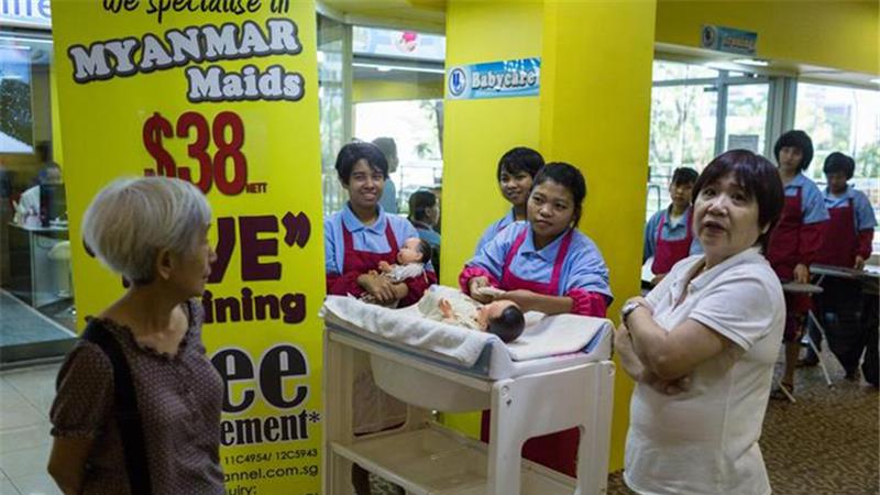 Domestic helpers at a showroom