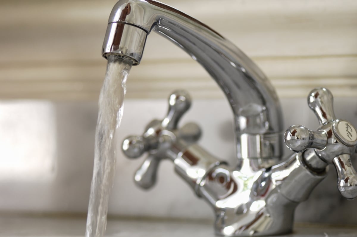 running tap as part of Chinese ritual for moving in a new house