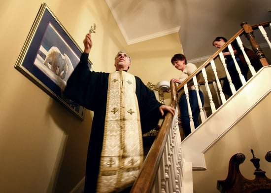 House blessing ritual by a priest