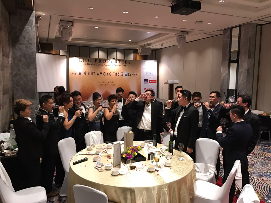 Lewis and property agents in celebratory mode at a LHG banquet earlier this year
