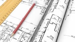 Set of floor plans and a pencil