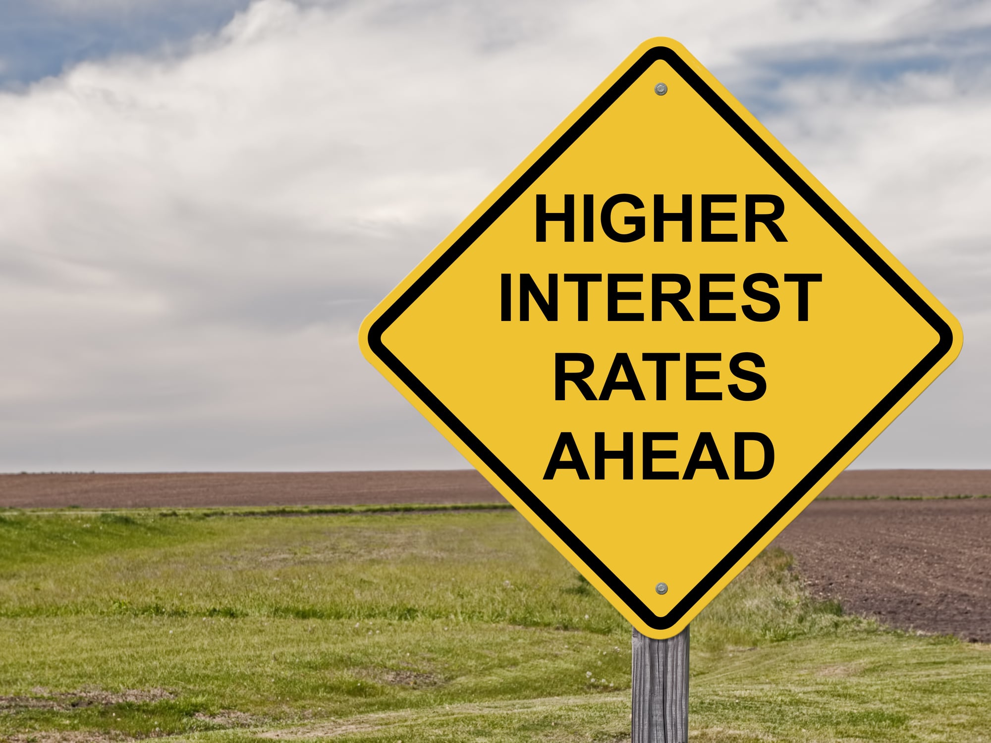 Road sign saying "higher interest rates ahead"
