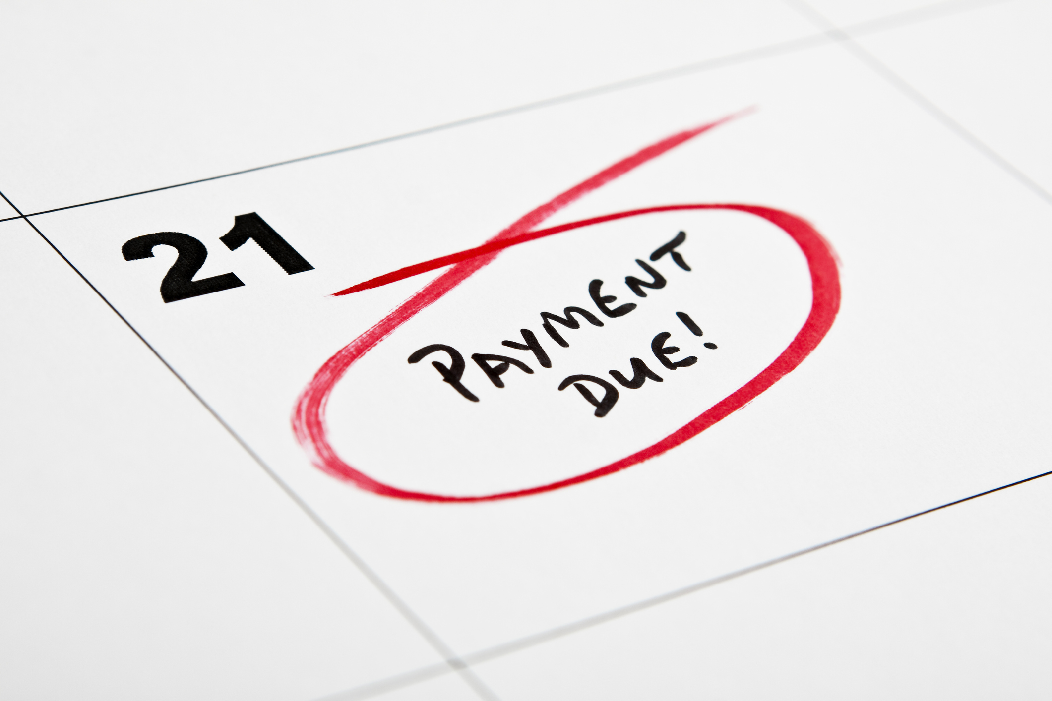 Circling the words "Payment Due!" on a calendar