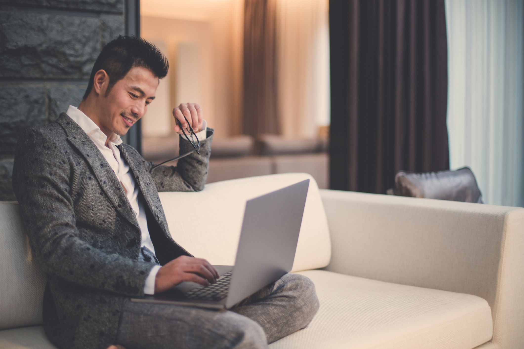 a man looking at a laptop