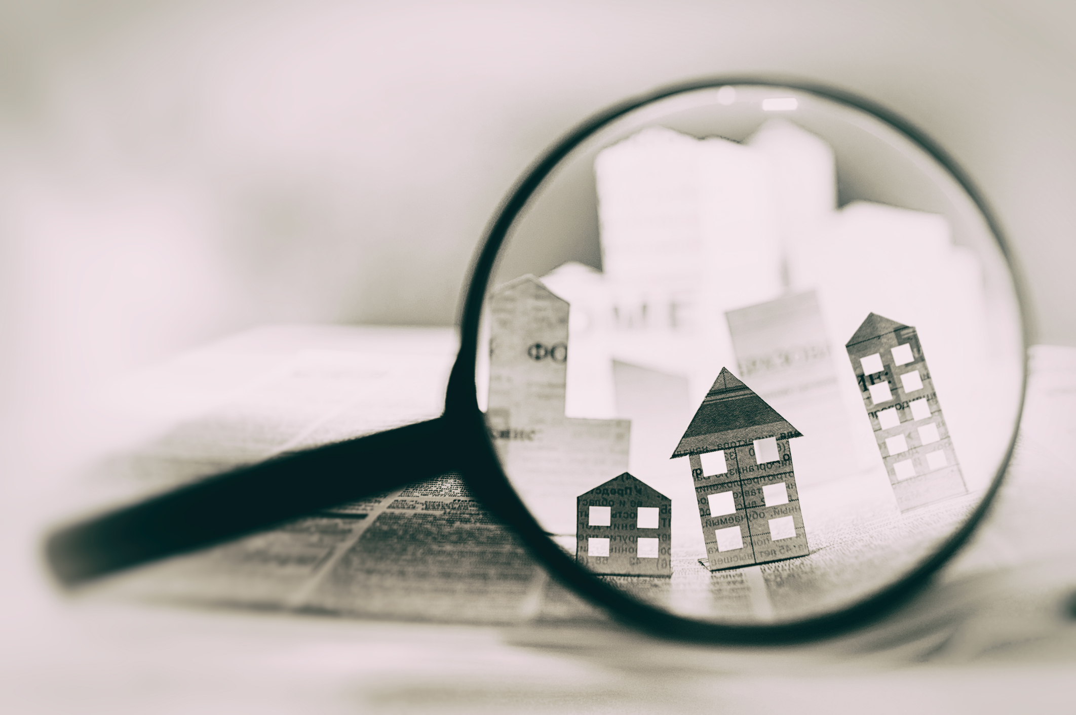 houses under magnifying glass