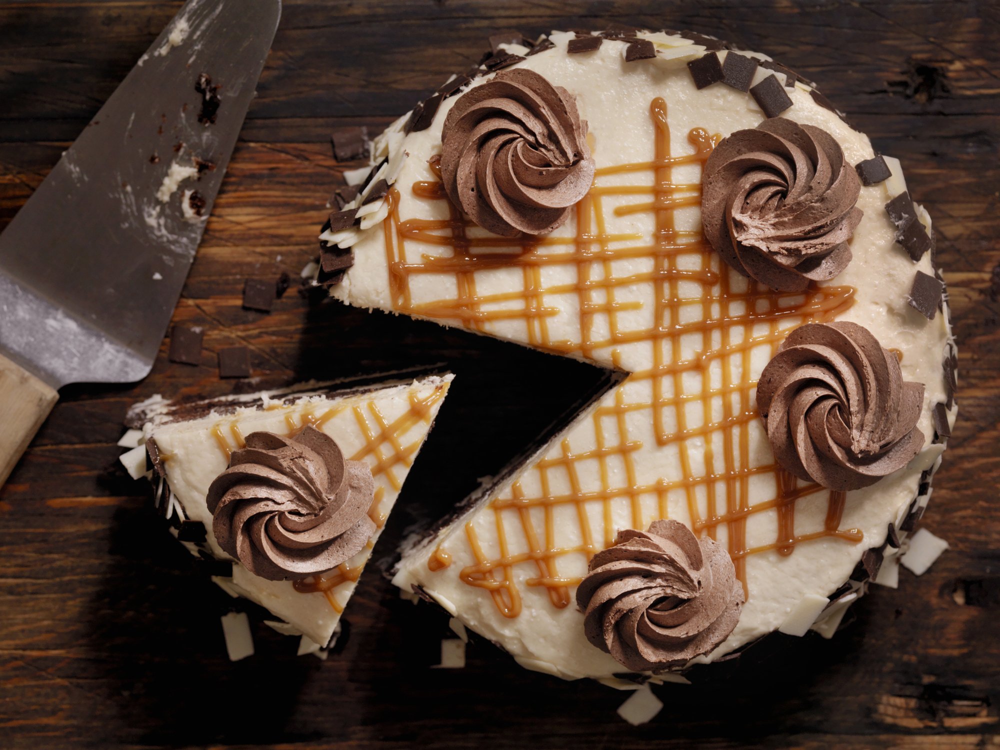 A slice of cake, cut from the whole cake