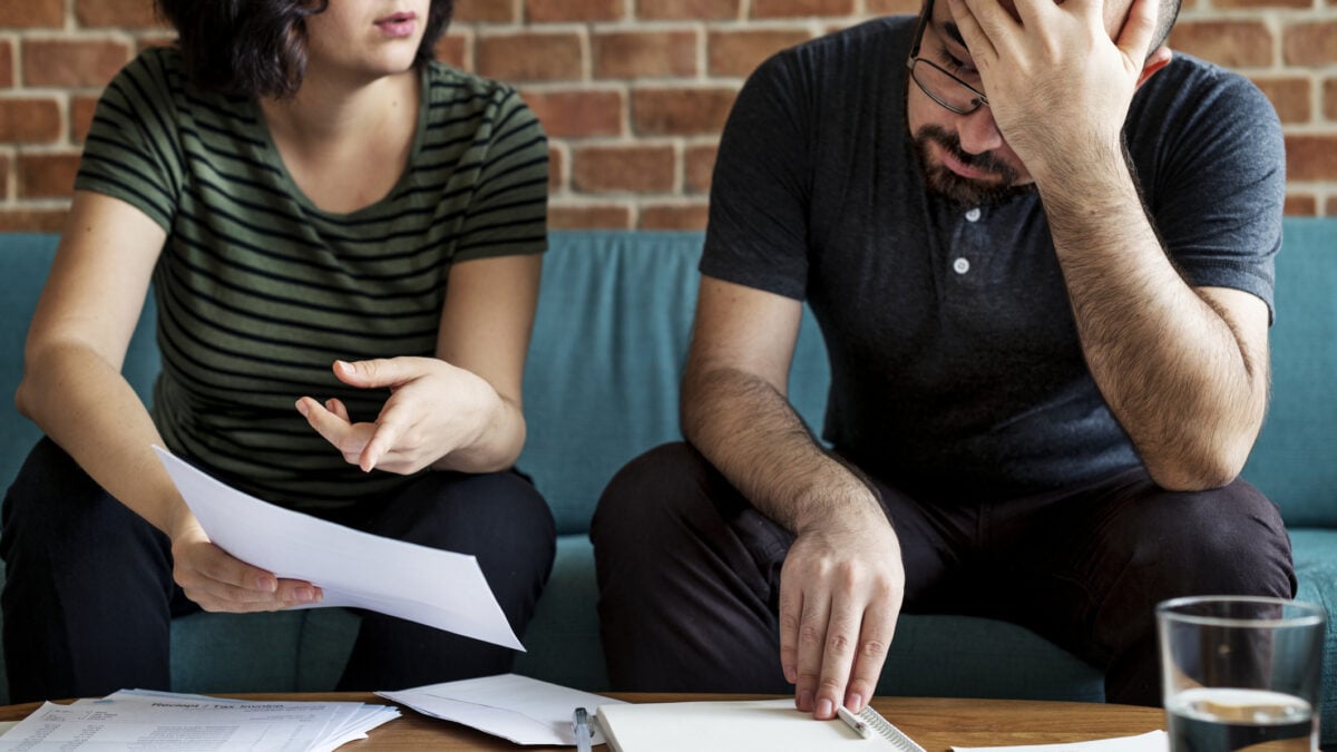 Two people arguing over some documents