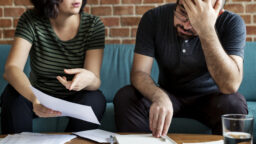 Two people arguing over some documents
