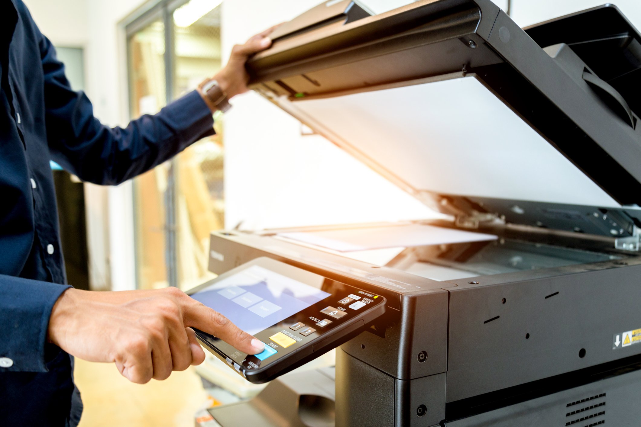 Someone using a photocopier