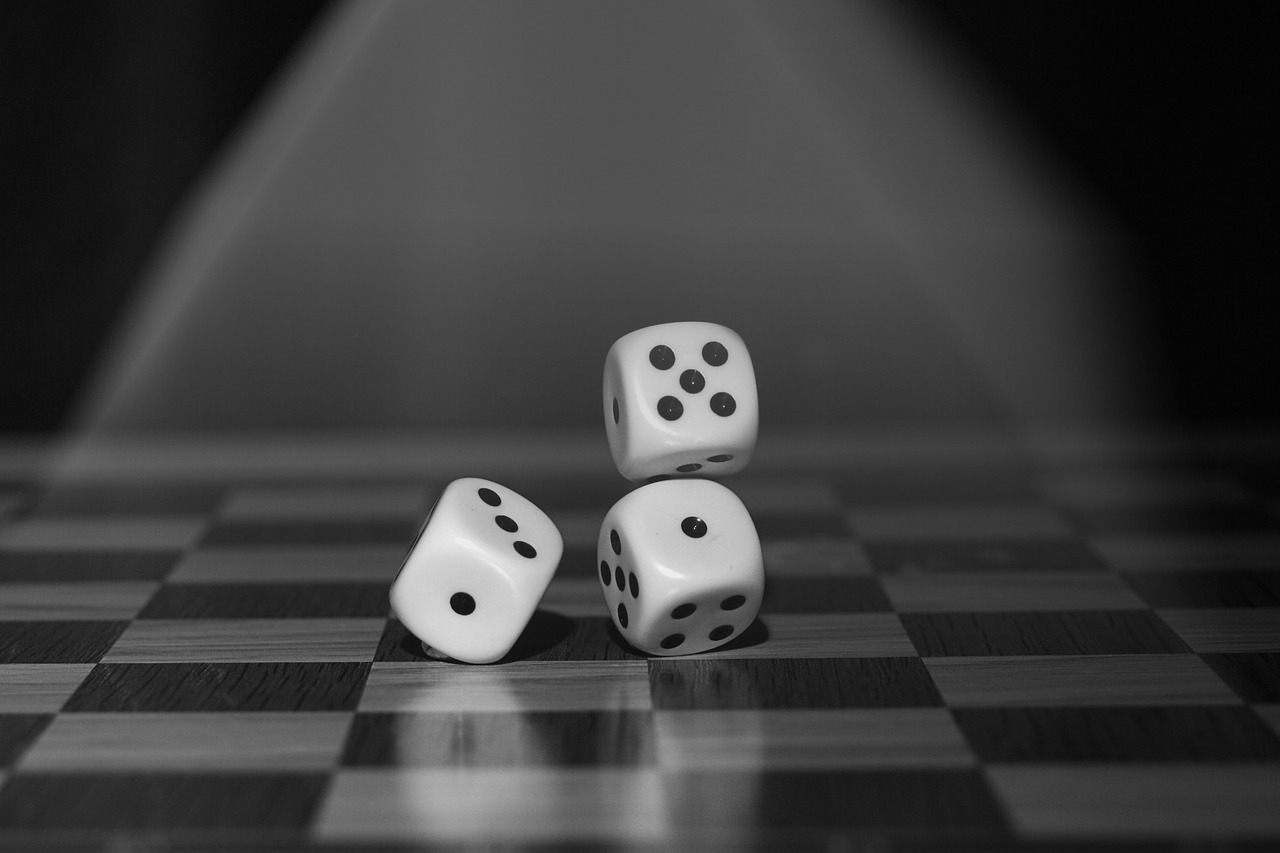 Three dice being rolled