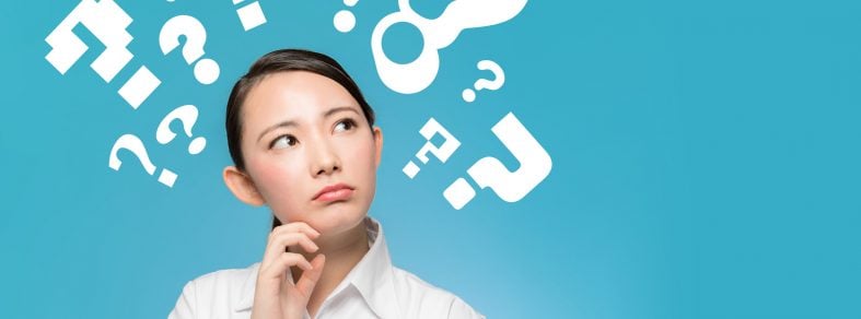 Asian woman looking up to think