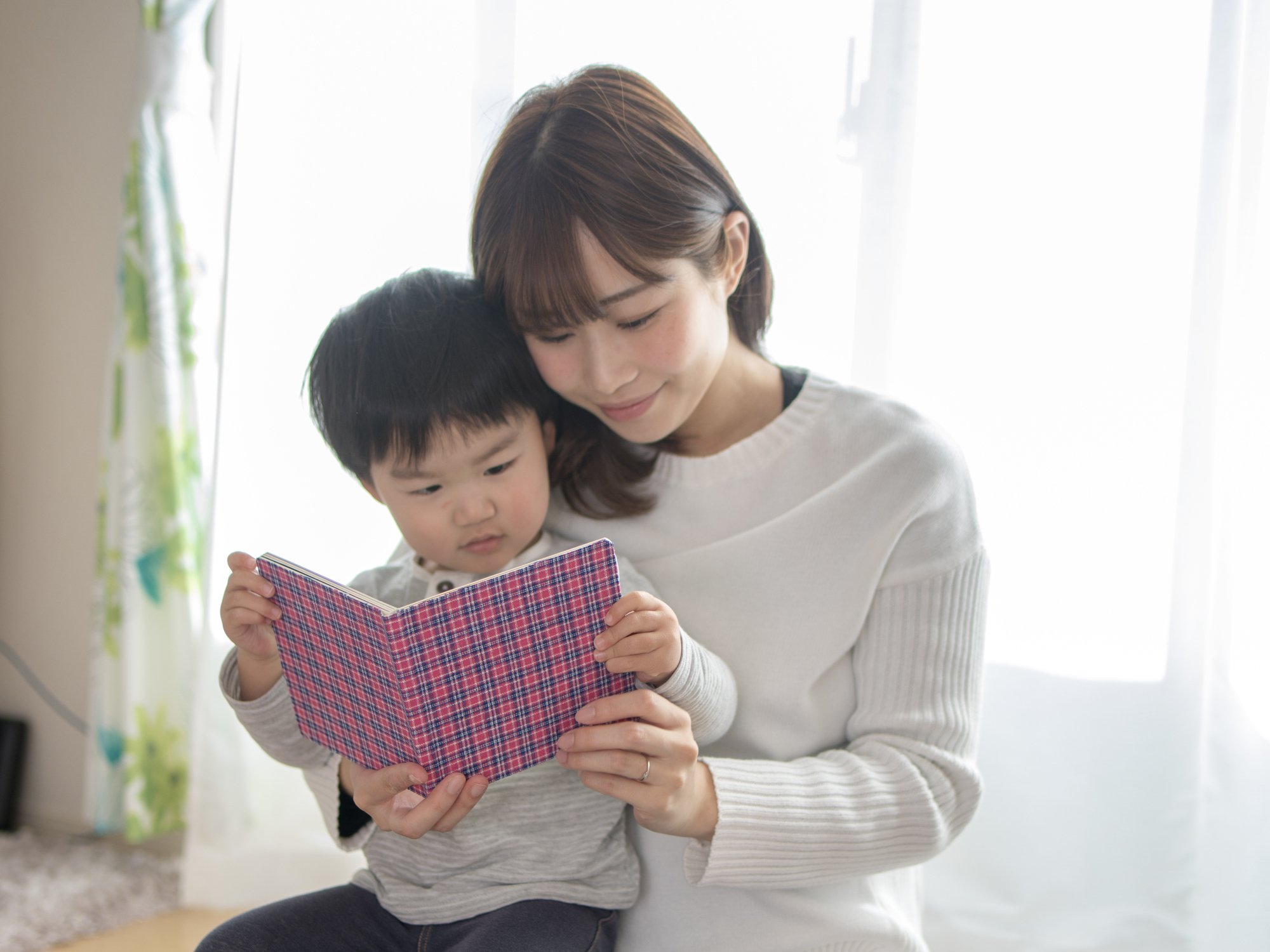 Mother teaching her child with special needs.