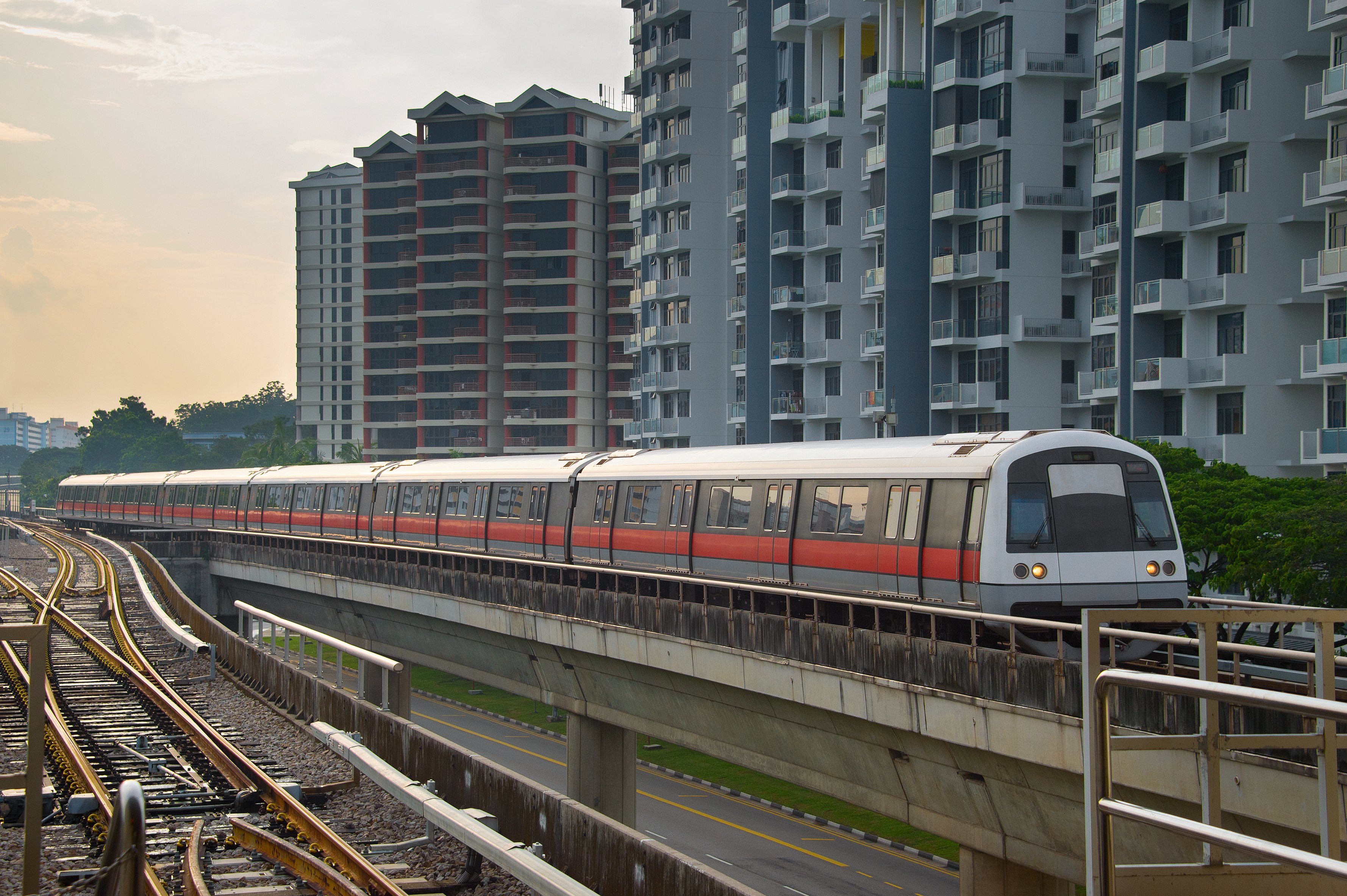 MRT train beside flats