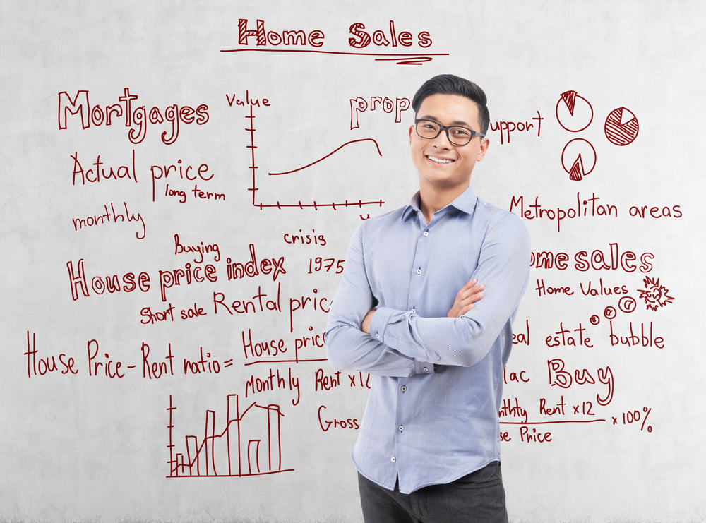 Man in front of board with complex property terms