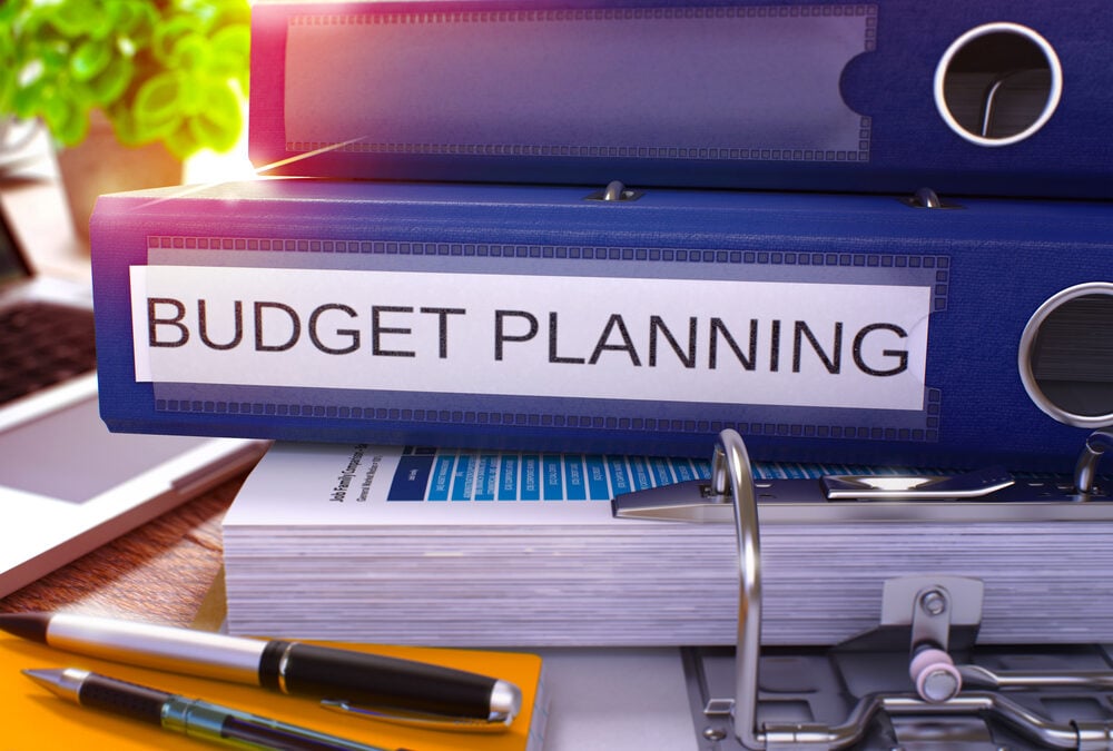 A stack of folders for budget planning