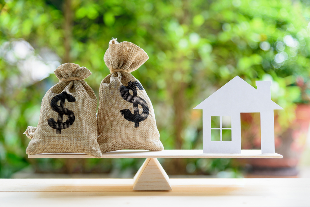 Two bags of money and a house balanced out