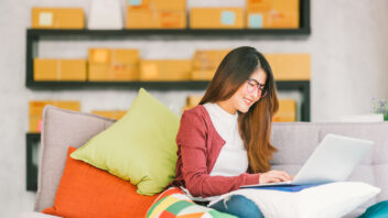 Woman working on her laptop at home