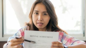 woman holding rental agreement paper