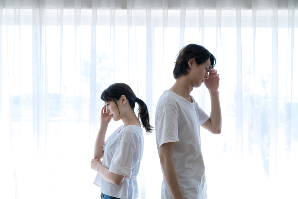 Two people avoiding each other.
