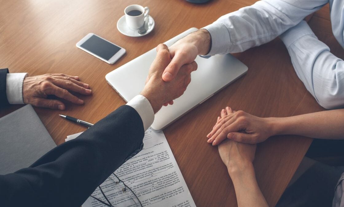 property agent and client shaking hands