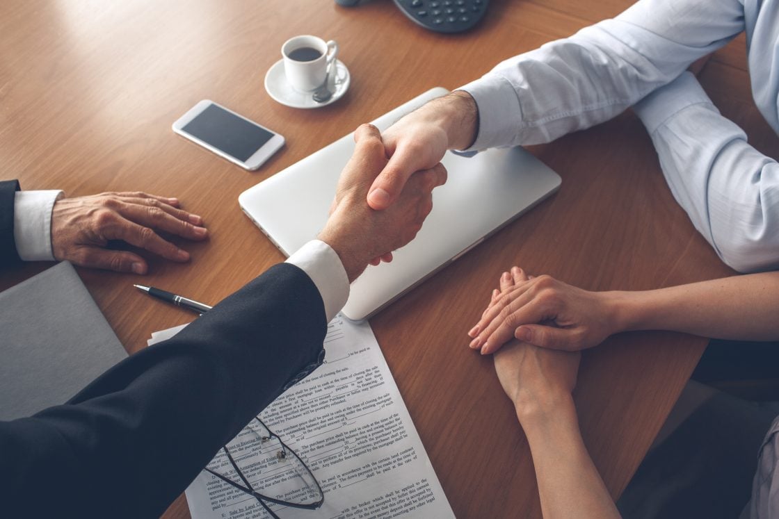 property agent and client shaking hands