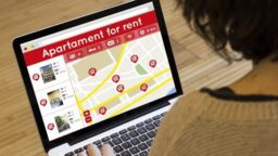 Woman Looking at Home Rental Listings