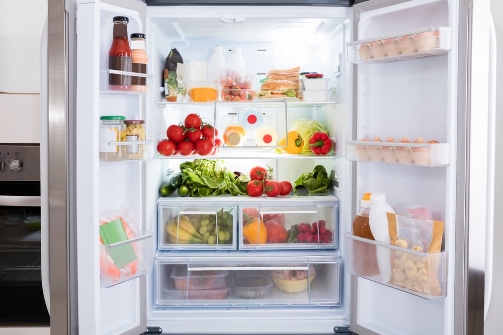A refrigerator full of food and drinks.