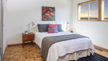 fully furnished bedroom with windom