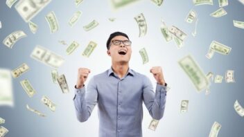 A man being joyous about his earnings.