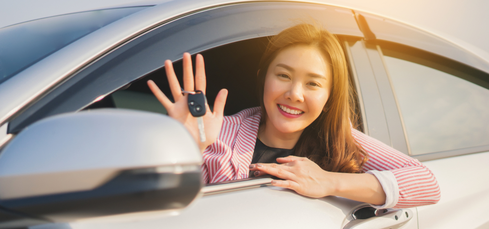 A woman driving her car.