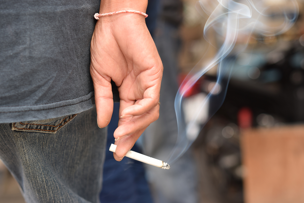 Man Holding Cigarette