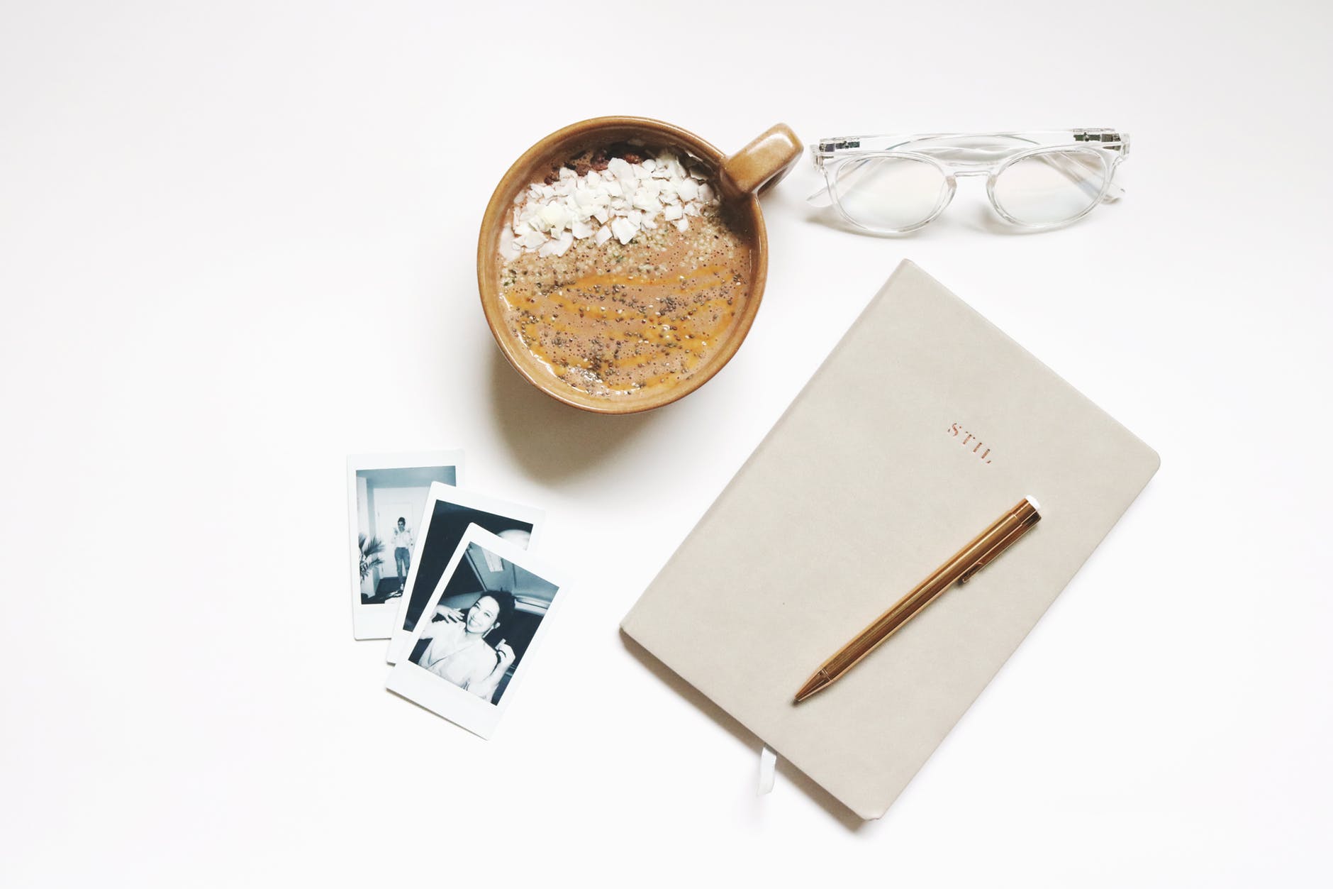 A diary, with several polaroids of an adult woman