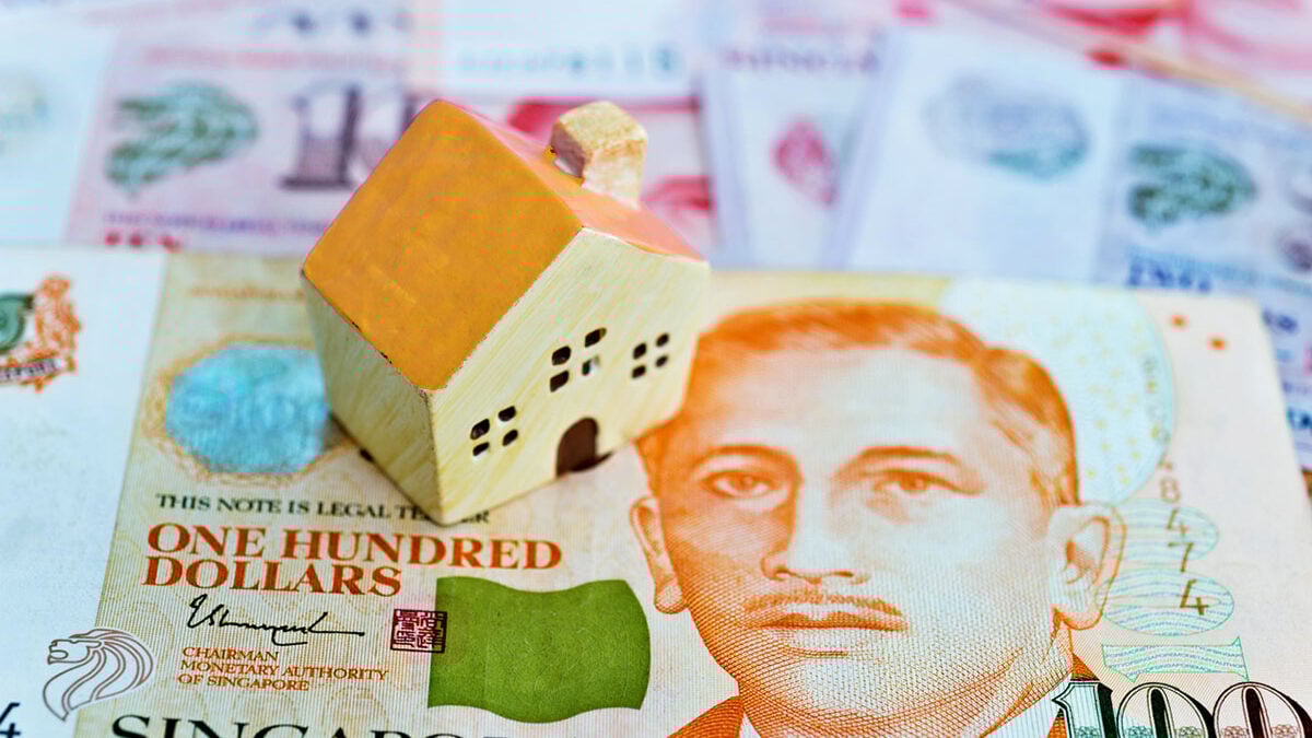 hundred singapore dollar and wooden house